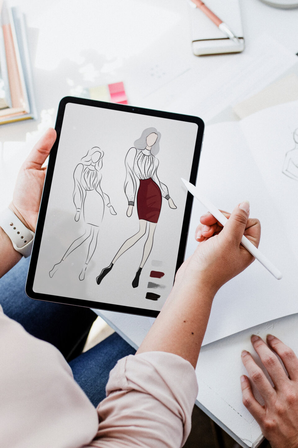 Fashion designer drawing on tablet